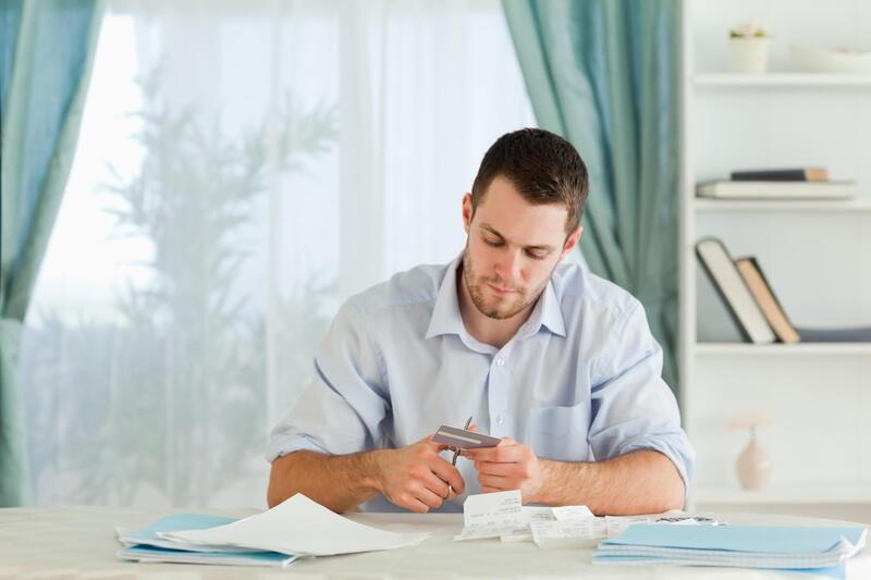 man sitting while checking documents