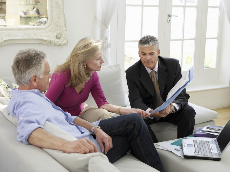 elderly couple consulting to financial advisor